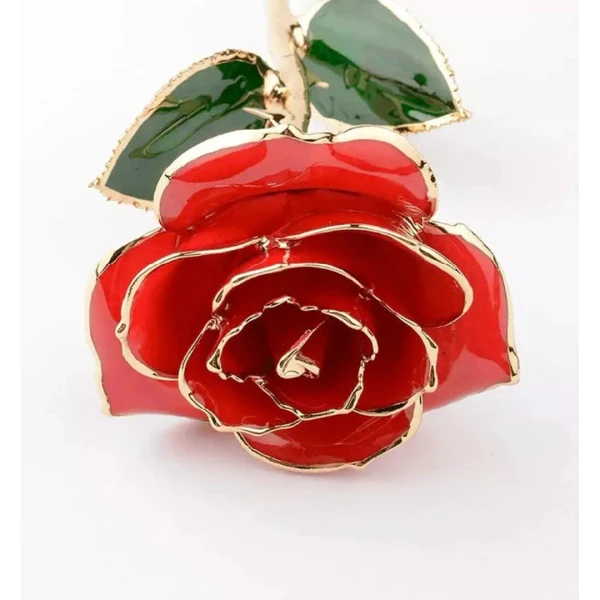 Red rose dipped in 24K gold with gold-trimmed green leaves.