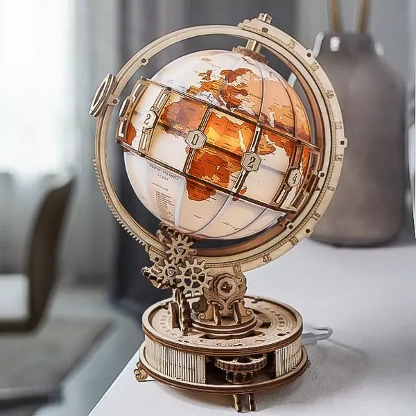 Wooden DIY globe with illuminated continents and rotating gears.
