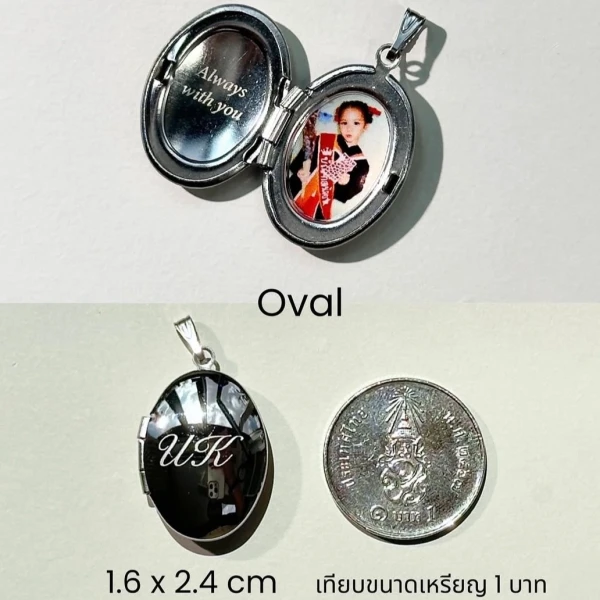 Oval locket with "Always with you" inscription and a child's photo, next to a Thai coin.