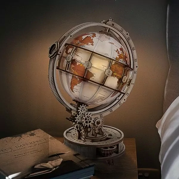A luminous, rotating DIY globe model on a wooden stand with intricate gears.