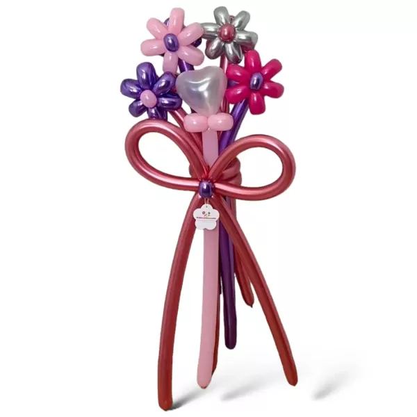 Balloon bouquet with pink, purple, and silver flowers, a heart balloon, and a red bow on a white background.