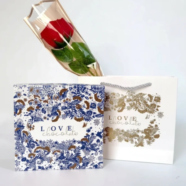 Red rose and "LOVE chocolate" gift box with floral patterns and a matching gift bag.