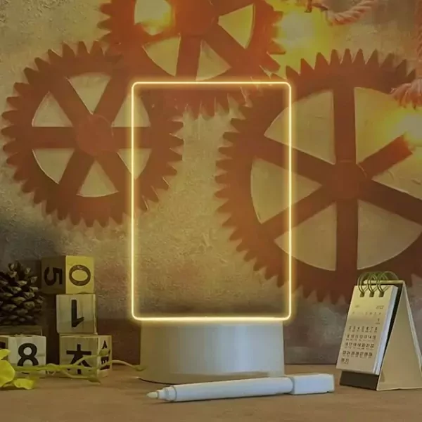 Neon-edged customizable lamp with drawing board, marker, and calendar on a desk.
