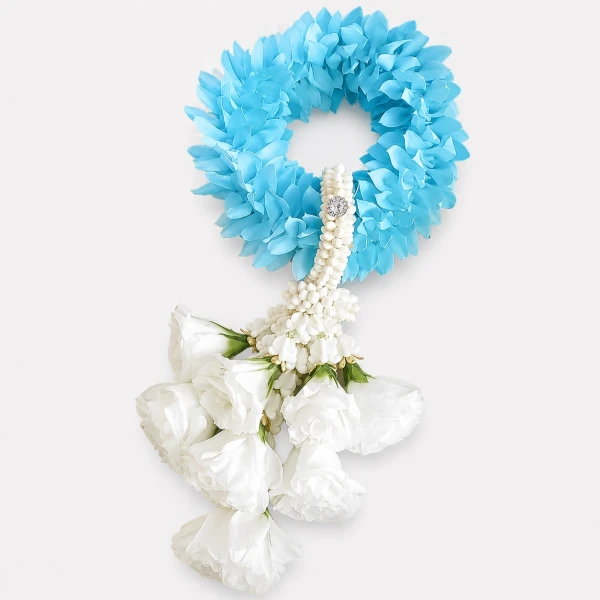 Blue flower wreath with white jasmine and roses in a gift box.