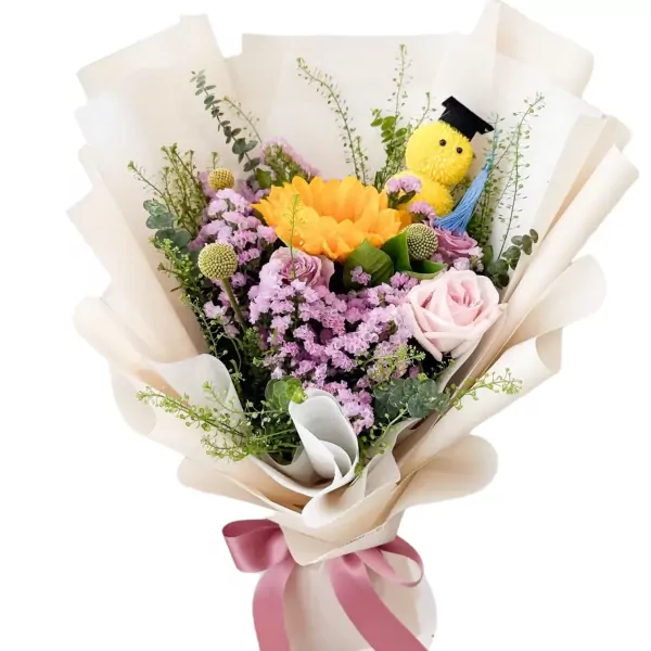 Graduation bouquet with yellow sunflower, pink roses, purple statice, and a graduation cap-wearing chick.