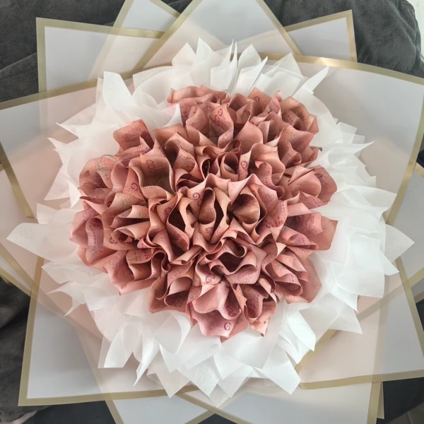 Money bouquet made of folded Thai Baht bills, shaped like roses.