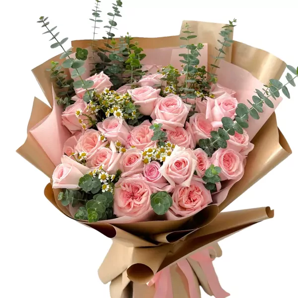 Bouquet of 24 pink roses, eucalyptus, and tiny white flowers wrapped in brown paper.