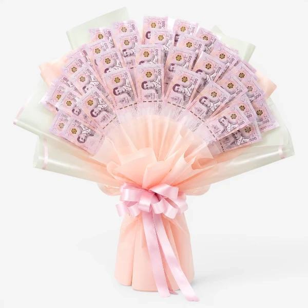 Bouquet of 500 Thai Baht banknotes arranged with pink and white paper, tied with a pink bow.