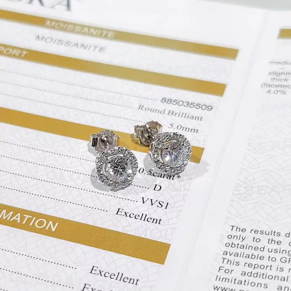 Pair of 0.5-carat round-cut moissanite diamond stud earrings on a certificate.