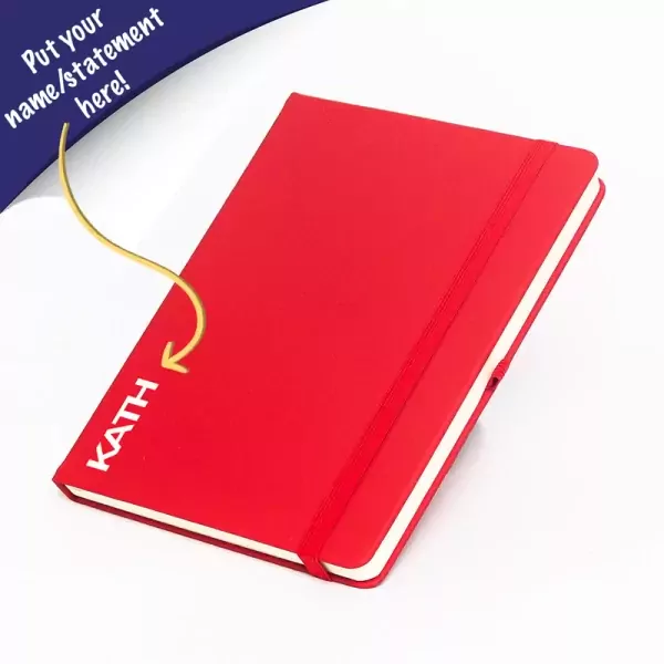 Red A5 leather journal with "KATH" embossed and elastic band.