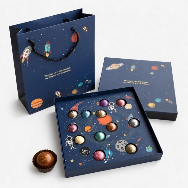 Open Galaxy Chocolate Box with 12 planet-shaped chocolates and space-themed gift bag.