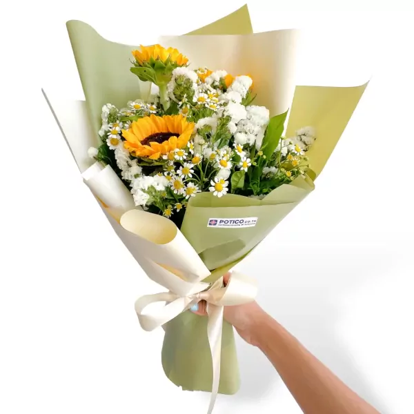 Bouquet of sunflowers and white dry statice flowers, wrapped in green and cream paper with a ribbon.