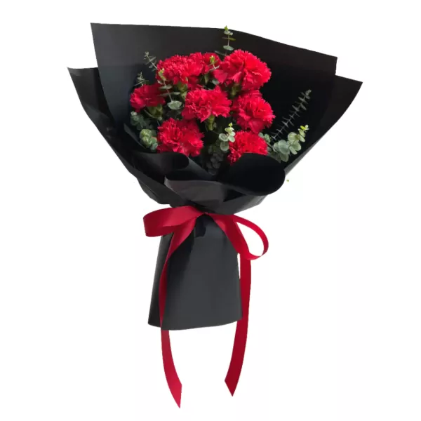 Red carnations with eucalyptus leaves, wrapped in black paper and tied with a red ribbon.