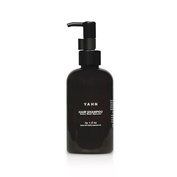Black pump bottle of YAHN Hair Shampoo with text labels.