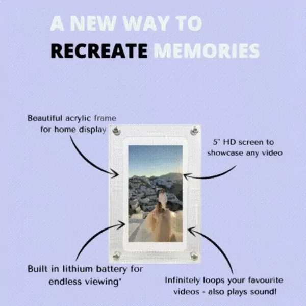 Digital video frame with acrylic casing showcasing a winter scene with a person and dog.