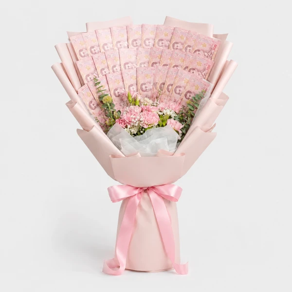 Pink money bouquet with flowers and pink ribbon against a white background.