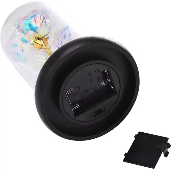 Glass dome with holographic rose and fairy lights, on a black base with battery compartment.
