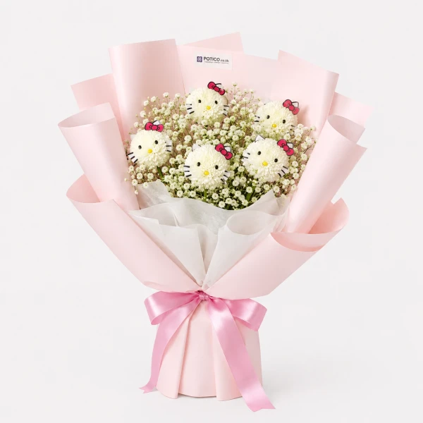 Hello Kitty flower bouquet with white baby's breath, wrapped in pink paper and tied with a pink ribbon.