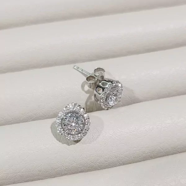 0.5-carat round-cut moissanite diamond stud earrings with a halo setting.