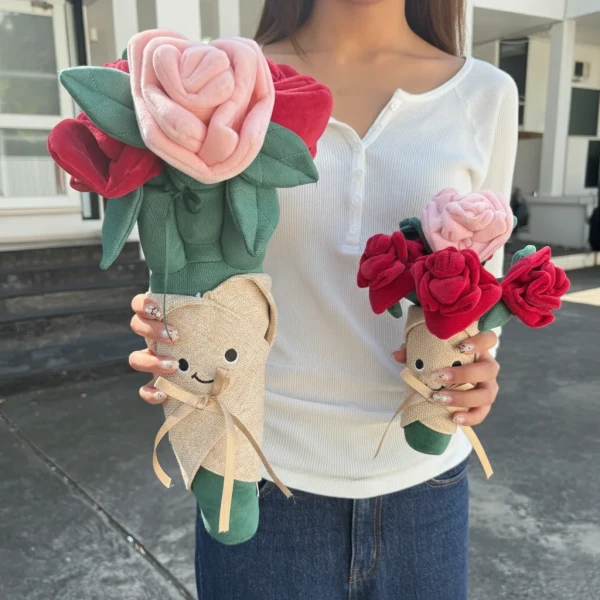 Plushy red roses bouquet with a smiling face on the pot, held by a person.