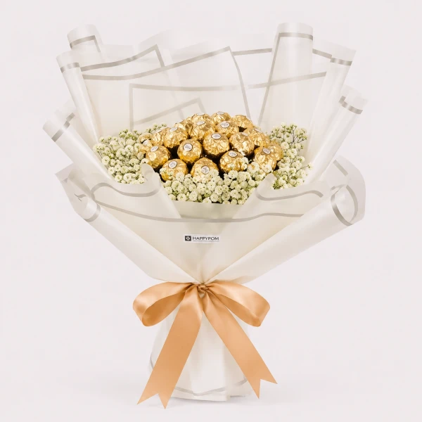 A bouquet of 19 Ferrero Rocher chocolates wrapped in white paper, adorned with white flowers and a gold ribbon.