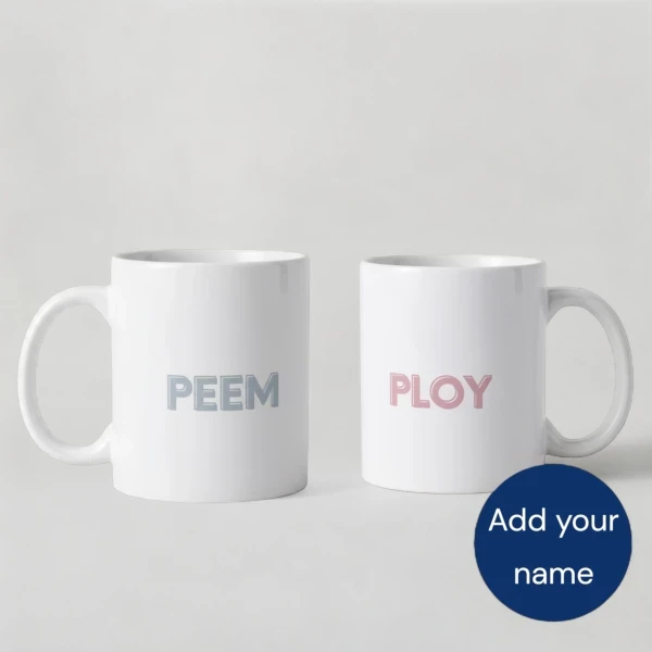 Two white mugs with cartoon bears. One bear wears a pink bow, the other a blue bow.