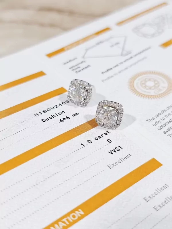 1-carat cushion-cut moissanite diamond earrings displayed on a diamond certificate.