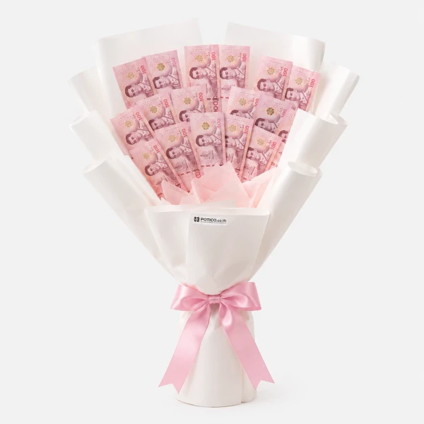 Money bouquet with pastel banknotes and a pink ribbon on a white background.