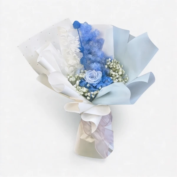 Blue rose and dried flowers bouquet with white and blue paper wrapping, on a white background.