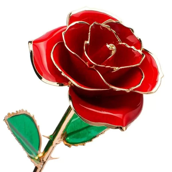 A red rose dipped in 24K gold with green leaves and gold stem.