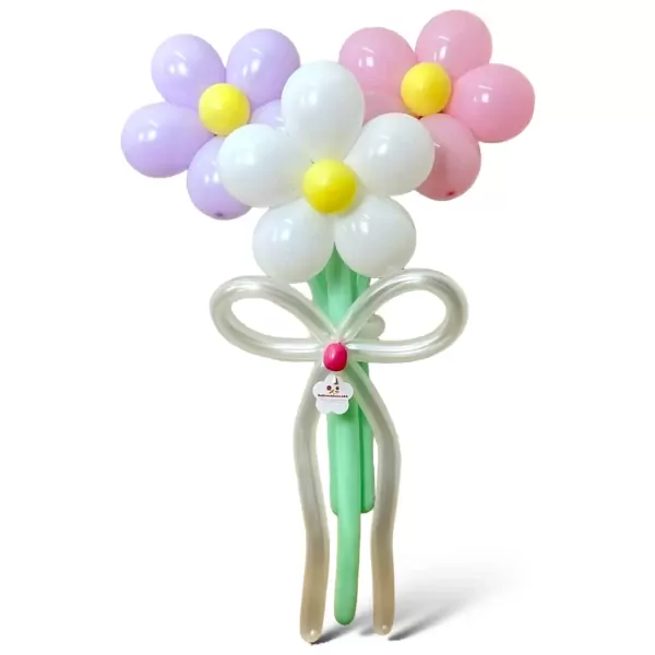 A balloon bouquet of three pastel daisies with yellow centers and green stems tied with a white balloon bow.