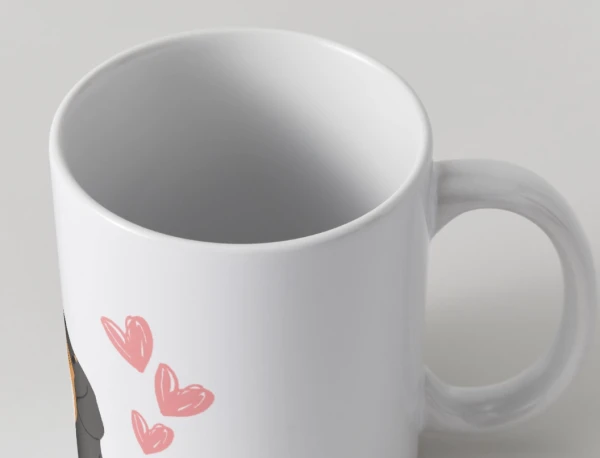 White mug with pink hearts and a dachshund's ear and nose visible.