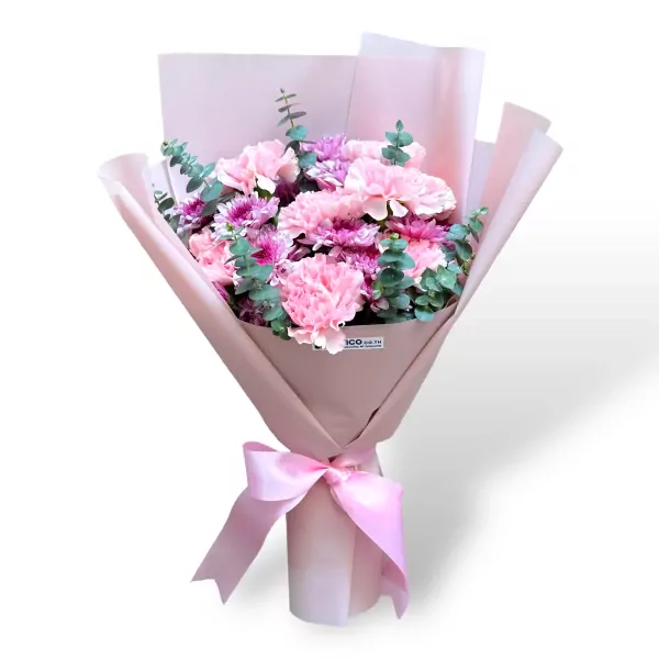 Bouquet of pink carnations and purple mums with eucalyptus, wrapped in pink paper and tied with a pink bow.