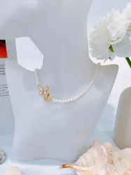 Pearl necklace with butterfly charm