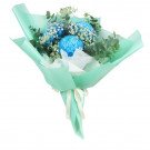 Blue chrysanthemums, baby's breath, and eucalyptus in mint green wrapping with cream ribbon.