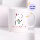 White ceramic mug with a cartoon character holding flowers and Vietnamese text saying "I love you the most."