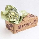 Bouquet of white and yellow daisies with baby's breath in green paper on a cardboard box with POTICO.VN logo.