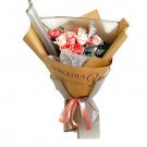 Pink and white roses bouquet wrapped in kraft paper with "Gorgeous You - For The Beautiful" text and pink ribbon.