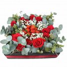 A rectangular box of red roses and strawberries, with baby's breath and eucalyptus.