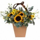 Basket of sunflowers, yellow daisies, and eucalyptus with a brown ribbon.