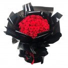 Bouquet of 150 red roses wrapped in black paper with red ribbon.