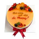Golden Zest Mousse Cake with fruits and "Chúc mừng sinh nhật chị Phương" message.