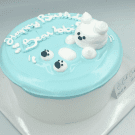 Blue cake with white frosting bear and "Happy Birthday" text.