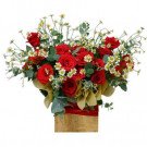 Red roses and daisies arranged in a wooden box, tied with a red ribbon.