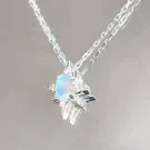 Sparkling crystal sun pendant necklace with a moonstone and small diamonds.