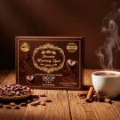 Le Chocolatier chocolate box with heart-shaped chocolates, cocoa beans, and a steaming cup of hot chocolate.