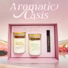 Aromatic Oasis gift set with two scented candles and perfume roller.
