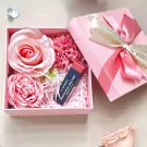 Pink gift box with MAC lipstick and silk roses.