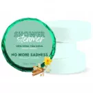 Shower steamers in packaging with pine wood and vanilla scents, beside bath bombs.