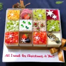 Christmas mousse cake set with 12 fruit flavors, decorated with snowflakes and a bow.